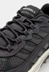Merrell Speed Strike 2 Trek shoes feature a dark gray mesh upper with rubber accents, intricate lacing, and a textured sole for grip.
