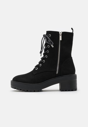 Stivaletti con plateau - black