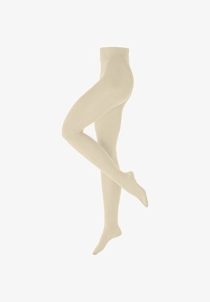 Calze color beige con trama a maglia a cavo mostrate su gambe incrociate contro uno sfondo bianco, che evidenziano la vestibilità e i dettagli del motivo.