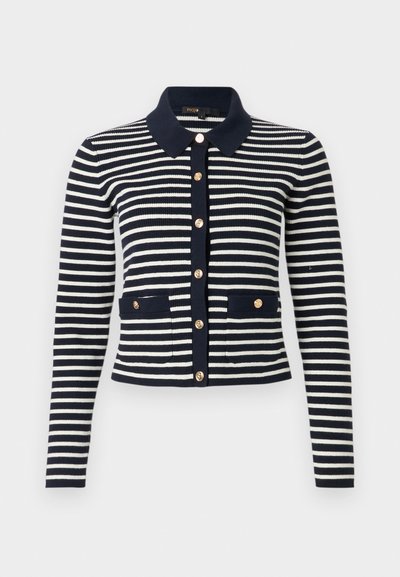Μπλε ναυτικό και λευκό ριγέ πλεκτή ζακέτα με μακρύ μανίκι, με χρυσά κουμπιά, μπλε γιακά και δύο εμπρόσθιες τσέπες με λεπτομέρειες κουμπιών.