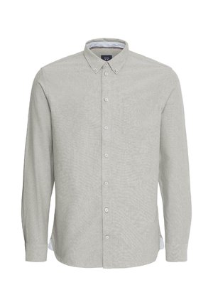 Svetlo siva majica s dugim rukavima, dugmadom na kragnu, prednjim žepom i suptilnom teksturom. Ima bele akcentne detalje na manžetama rukava.