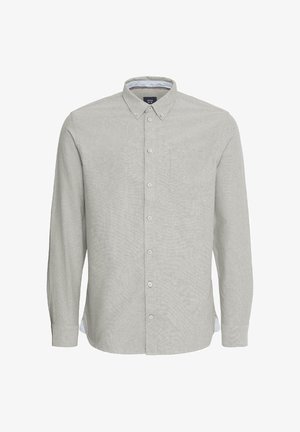 Heledhall halli pika varrukaga särk, millel on nööbiga krae, eesmine tasku ja peen tekstuur. Kätetutid on valgete aktsentidega.