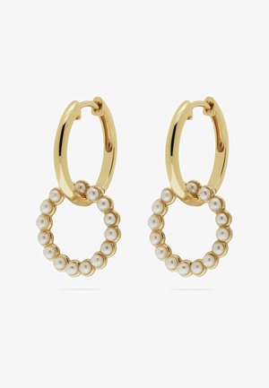 Guldtonede hoop øreringe har et hængende cirkulært design prydet med små, ensartede perler, der skaber en tekstureret kontrast.