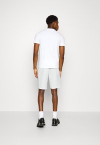 Calvin Klein MICRO LOGO REPREVE - Donji dijelovi trenirke - bright white