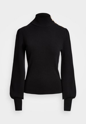 Svart polotröja med ribbad textur, puffärmar, figursydd kropp och guldknappdetaljer på axeln.
