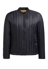 Black puffer jacket featuring vertical quilting, a ribbed collar, and a zippered front. It has side pockets and a smooth, glossy texture.
