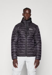 Black puffer jacket with hood, featuring stitched panels, a front zipper, and a logo on the left chest. Smooth texture, lightweight design.