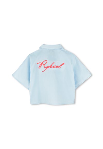 Light blue short-sleeve shirt with a collar, featuring a pink embroidered "Rykiel" logo centered on the back. Textured fabric design.