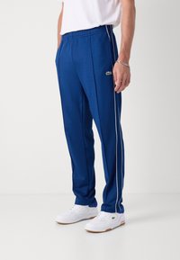 Lacoste Tepláky - globe