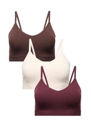 Tre sømløse bralette toppe med tynde stropper i brun, creme og mørk burgundy farver, arrangeret overlappende på en hvid baggrund.
