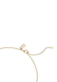 Gold-toned chain bracelet features a lobster clasp and adjustable length, with a small tag engraved with "Coach" for added detail.