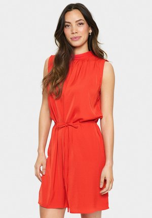 Red sleeveless dress features a high neckline, gathered detailing, and a tied waist. Smooth fabric with a relaxed fit and knee-length hem.