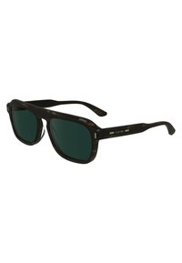 Lunettes de soleil en écaille noire avec verres vert foncé. Forme carrée, accents discrets sur les côtés et design élégant des branches, ornées du logo Calvin Klein.