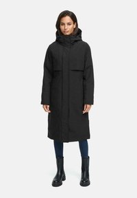 Black long coat with a hood, featuring a zip front and two large pockets. The material appears smooth with a matte texture.