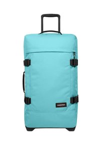 Bolsa de viaje con ruedas color turquesa, con asa retráctil, correas laterales ajustables y detalles en negro. Tejido duradero y forma rectangular.