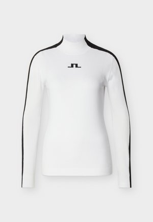 Suéter blanco de manga larga con cuello alto, con rayas negras a lo largo de las mangas y un pequeño logo negro centrado en el pecho.