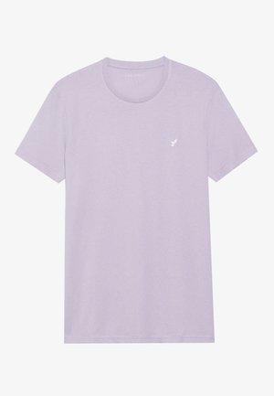 T-shirt à manches courtes violet clair, col rond, fabriqué en tissu doux. Présente un petit logo blanc sur la zone gauche de la poitrine. Design simple.