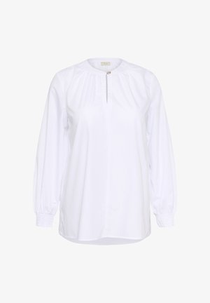 Valkoinen pitkähihainen pusero, jossa on kerätty pääntie, avainaukko ja joustavat hihansuut. Valmistettu sileästä kankaasta, hieman löysällä istuvuudella.