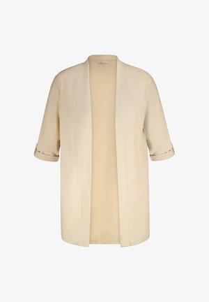 Cardigan kimono léger beige avec des manches roulées, une ouverture à l'avant et une texture douce. Présente un design simple sans embellissements.