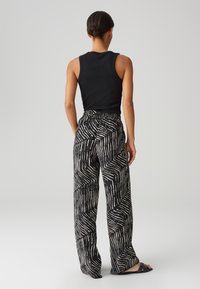 OPUS - Spodnie materiałowe