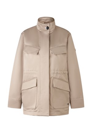 Beige waterproof jacket with high collar, front button closure, four exterior pockets, and smooth, shiny fabric texture.