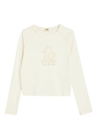 Långärmad krämfärgad sweatshirt med rund halsringning, med en upphöjd beige logotypdesign och subtila sömdetaljer.