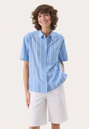 Light blue short-sleeve button-up shirt with white vertical stripes and a chest pocket, paired with white knee-length shorts.