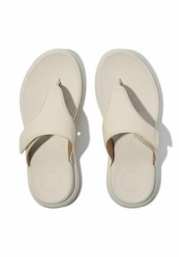 Infradito beige chiaro con suola in gomma morbida, caratterizzati da un design con fascetta per le dita e un plantare imbottito, adatti per un look casual.