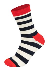 Gestreifte Socke in Creme, Marineblau und Rot. Verfügt über einen roten, gerippten Bund, mit abwechselnden Streifen in Marineblau und Creme sowie Details in Rot an Ferse und Zehen.