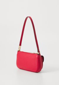 Red textured leather handbag with a thin shoulder strap and gold hardware. Zipper closure, rectangular shape, smooth edges.