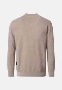 Beige stickad tröja med ett texturerat mönster, rund halsringning, långa ärmar och ribbad nederkant. Har en sidodetalj med varumärkesetikett.