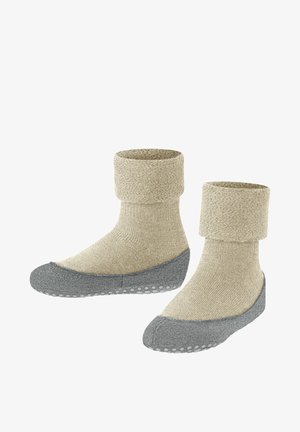 Beige Stricksocken mit umgeschlagenem Bündchen, grauer gepolsterter Sohle und strukturierten Gummipunkten für besseren Halt. Weicher Stoff mit glattem, gemütlichem Aussehen.