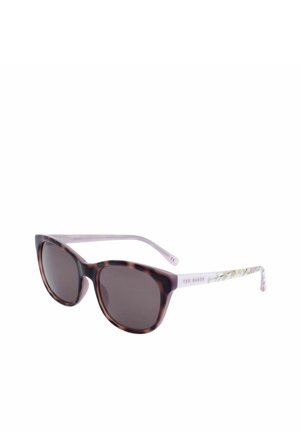 Occhiali da sole a occhi di gatto con lenti scure e montatura frontale in tartaruga, aste viola chiaro con motivo floreale e branding Ted Baker.