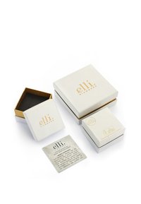 Elli Diamonds emballage inkluderer tre hvide æsker med guldaccenter og et certifikationskort med elegant typografi og teksturdetaljer.