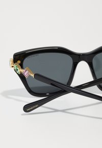 Swarovski Saulesbrilles - black