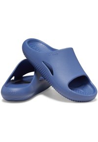 Blue rubber clogs with open toe design, textured footbed, and side cutouts. "crocs" logo visible on the upper surface. Lightweight and flexible.