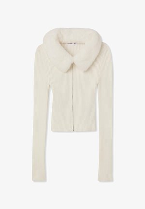 Cardigan a coste crema con colletto in pelliccia sintetica, zip frontale e maniche lunghe. Tessuto liscio con un design aderente.