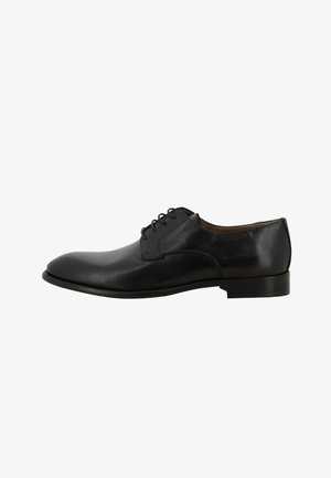Scarpa da uomo elegante in pelle nera con lacci, tacco basso e punta arrotondata, mostrata di profilo su sfondo bianco.