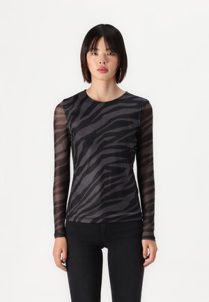 Long-sleeve black top with sheer zebra-patterned sleeves, fitted design, smooth fabric, round neckline, and slight stretch.