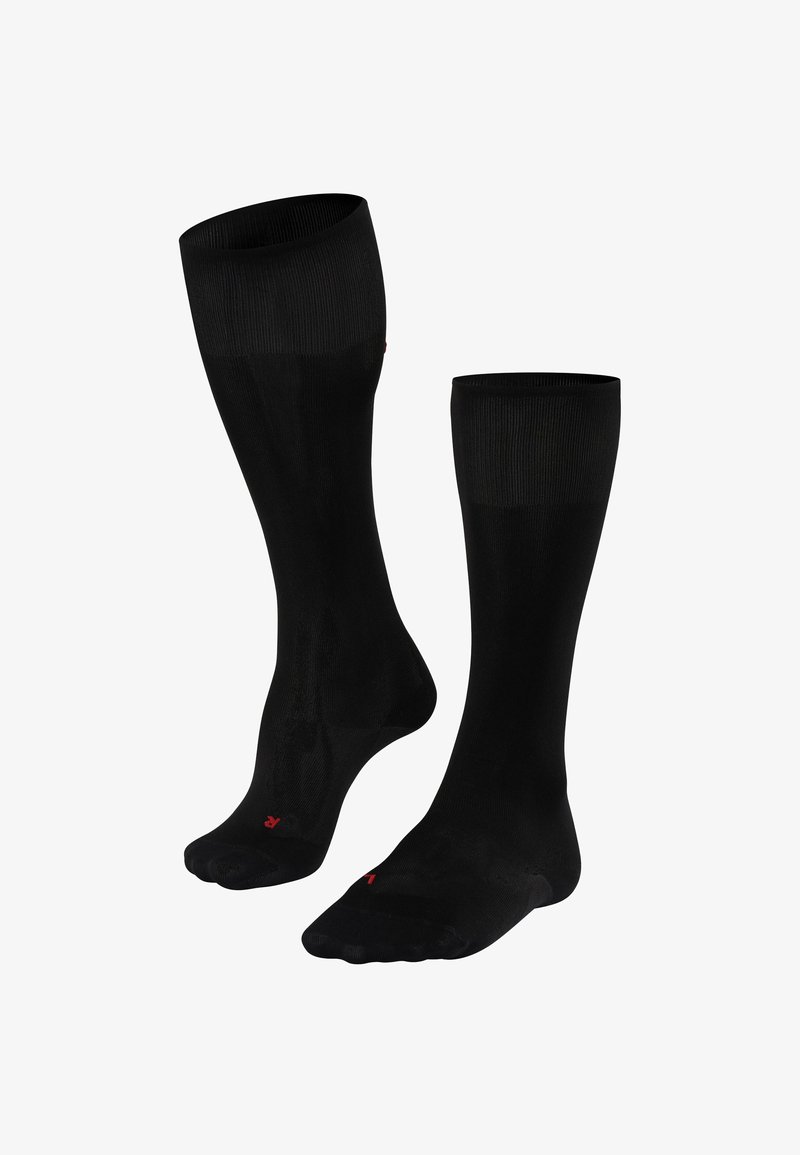 Chaussettes noires montantes avec une texture lisse, un haut côtelé et un petit logo rouge sur le pied. Conçues pour le confort et la durabilité.