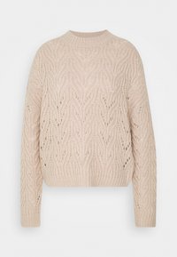 Lichtbeige gebreide trui met een gestructureerd, bladachtig patroon. Heeft een ronde halslijn en geribbelde zoom en manchetten. Verkort design.