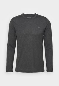 Long-sleeve shirt in dark gray, made from soft fabric. Features a crew neck and a small white logo on the chest. Classic fit.