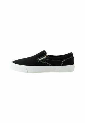 Black canvas slip-on shoes with a white rubber sole and contrasting white stitching. Rounded toe and elastic side panels for easy wear.