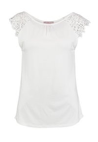 Vit ärmlös topp med spetsdetaljer på axlarna, mjukt tyg, rund halsringning och en avslappnad passform, lämplig för avslappnad användning.