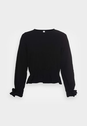 Top negru cu mânecă lungă, guler rotund, talie strânsă și manșete legate; fabricat dintr-un material moale și ușor.