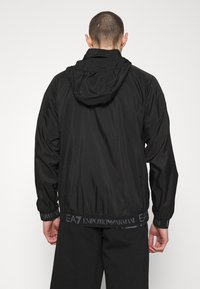 EA7 Emporio Armani Tunn jacka - black