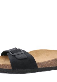 Sandale à glissière en daim noir avec sangle et boucle réglables, dotée d'une semelle en liège et d'une semelle en caoutchouc texturé.