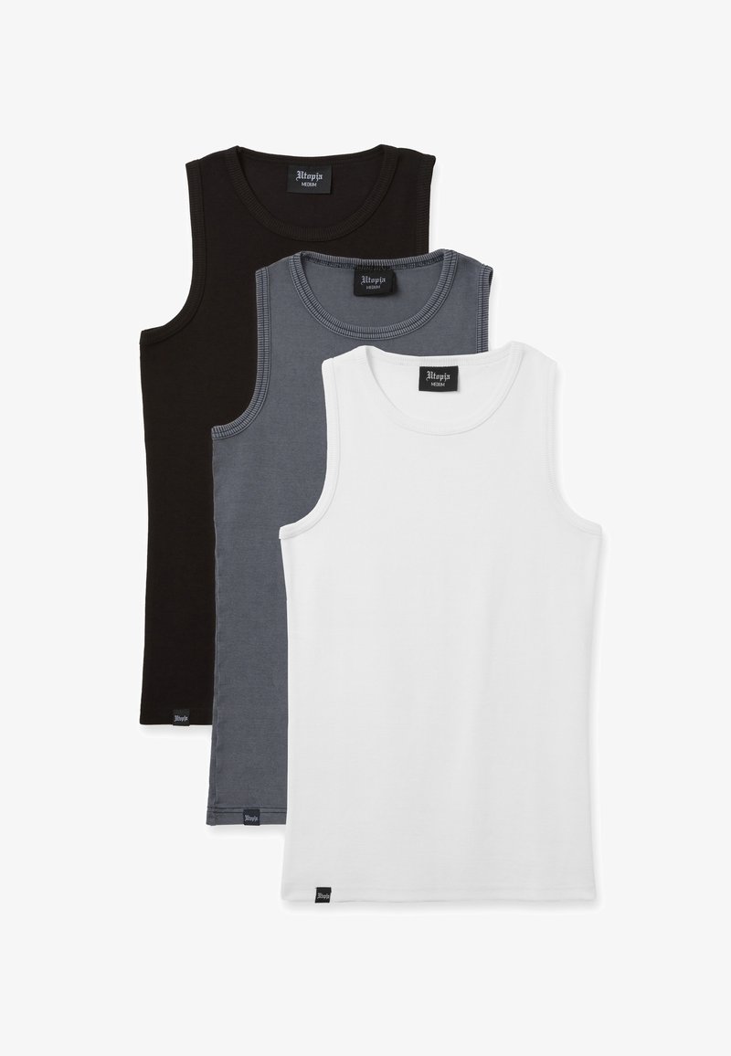 Tres camisetas sin mangas de algodón en negro, gris y blanco. Cada una presenta un escote redondo y un dobladillo recto, con una etiqueta de la marca en la parte inferior.