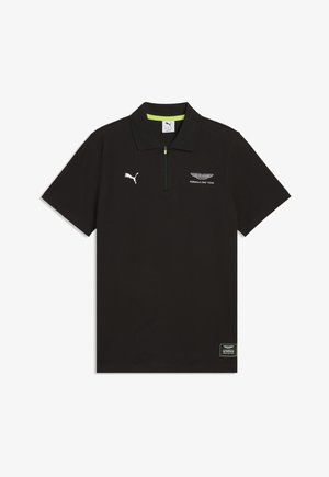 Polo nera a maniche corte con mezza cerniera, logo Puma sul petto destro, loghi Aston Martin Formula One Team sul petto sinistro e sull'orlo inferiore.