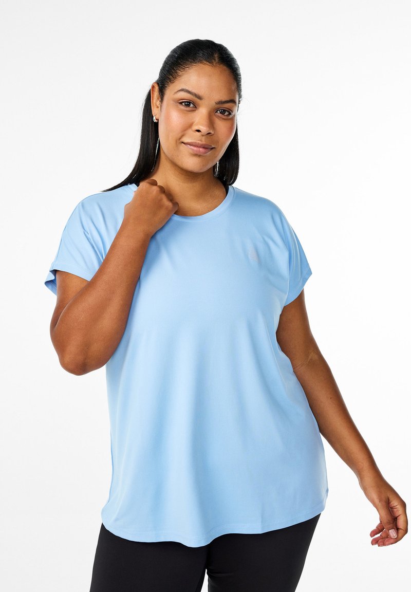 Light blue short-sleeve t-shirt with a round neckline, smooth texture, and loose fit, paired with black bottom wear.